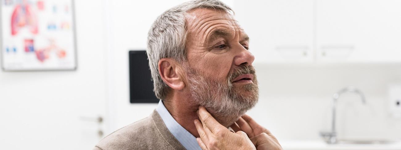 doctor checking patients neck
